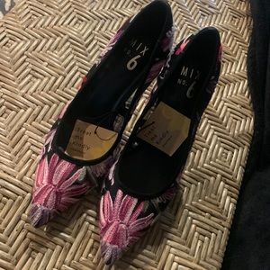 Embroidered shoes in pinks and purples